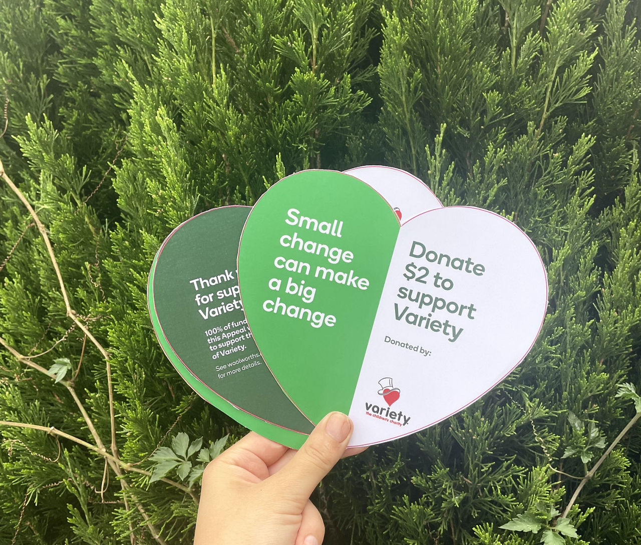 Image of two heart shaped tokens promoting the Small Change Appeal.