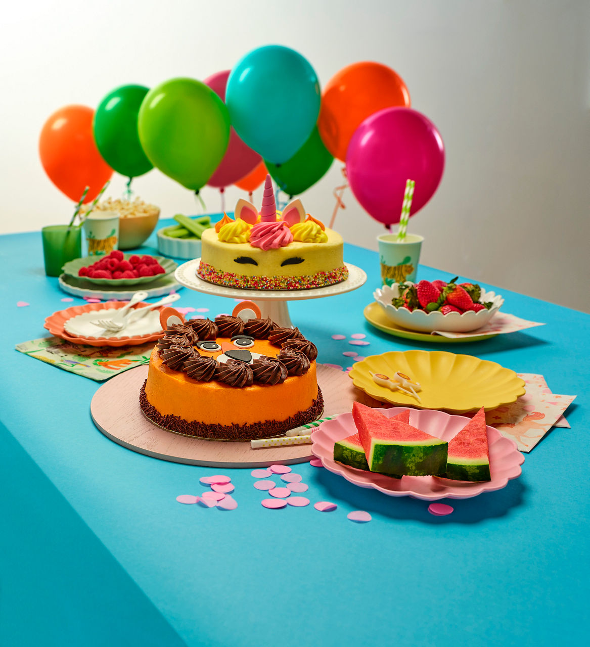 Assortment of cakes on table with balloons