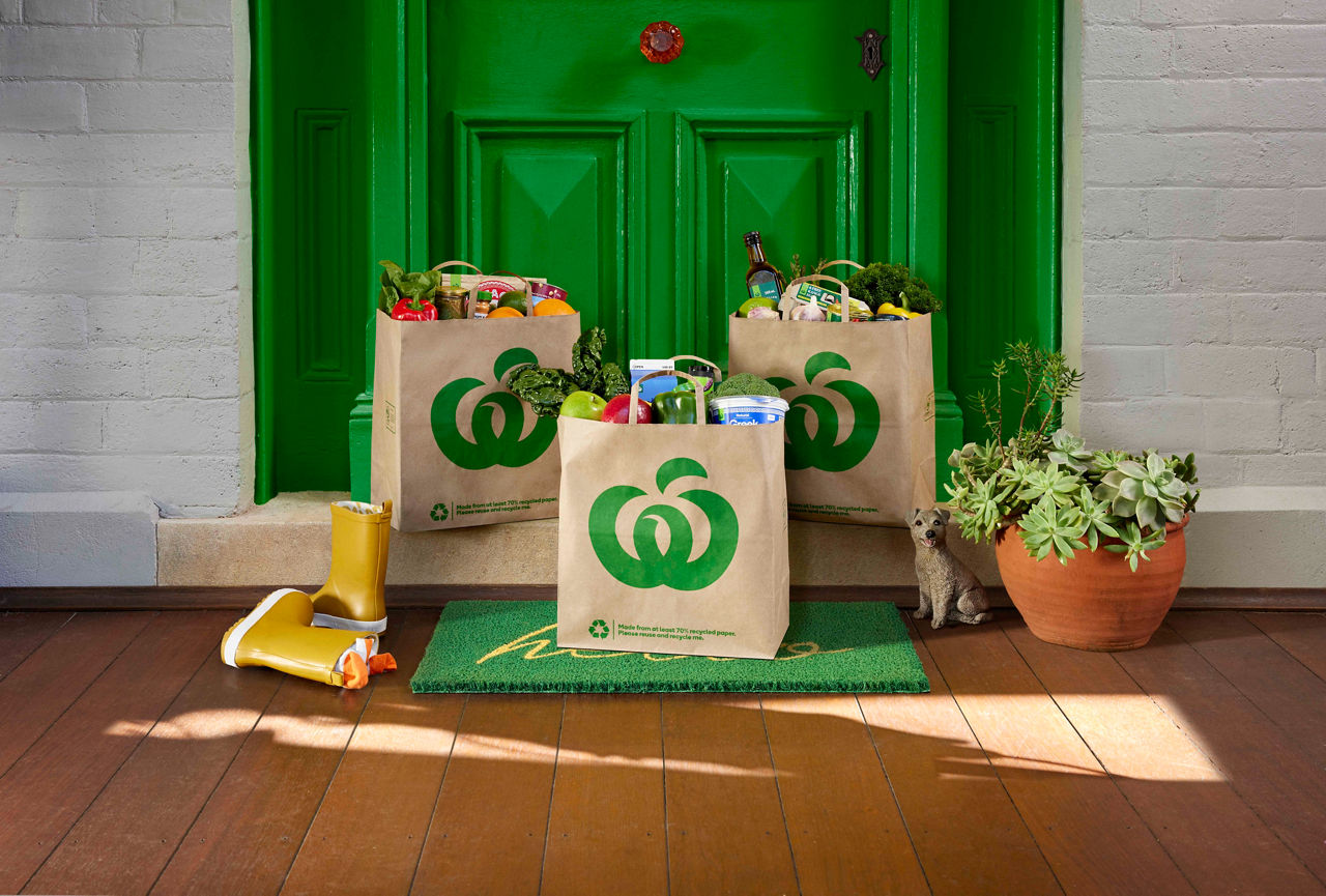 Three bags of groceries delivered and on the door step of a home