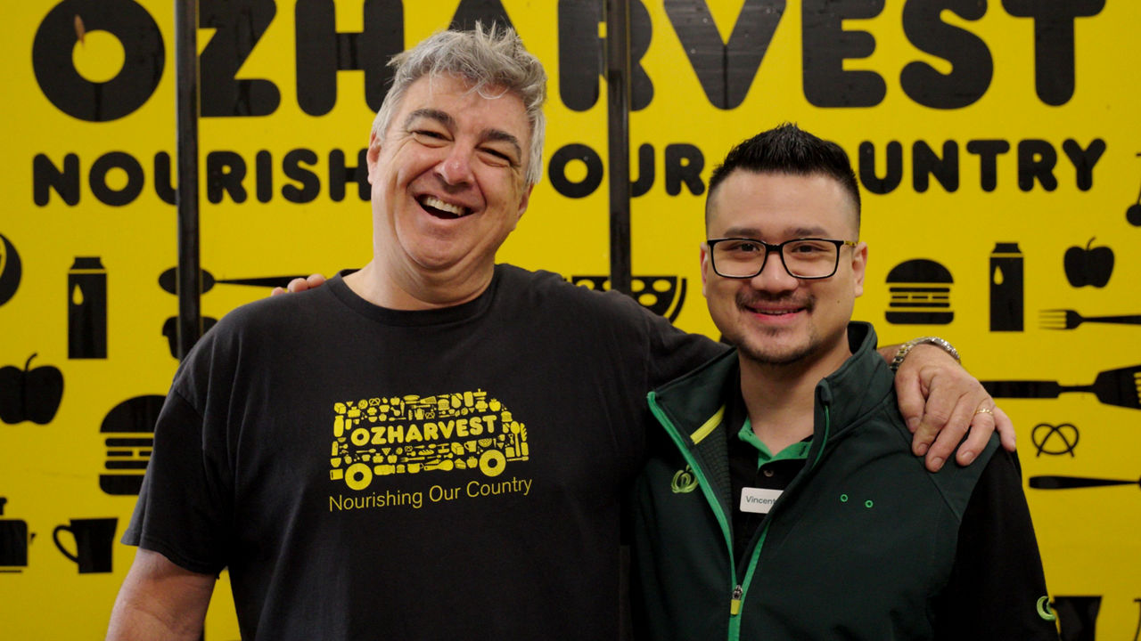 OzHarvest and Woolworths team members celebrating 100 million meal milestone