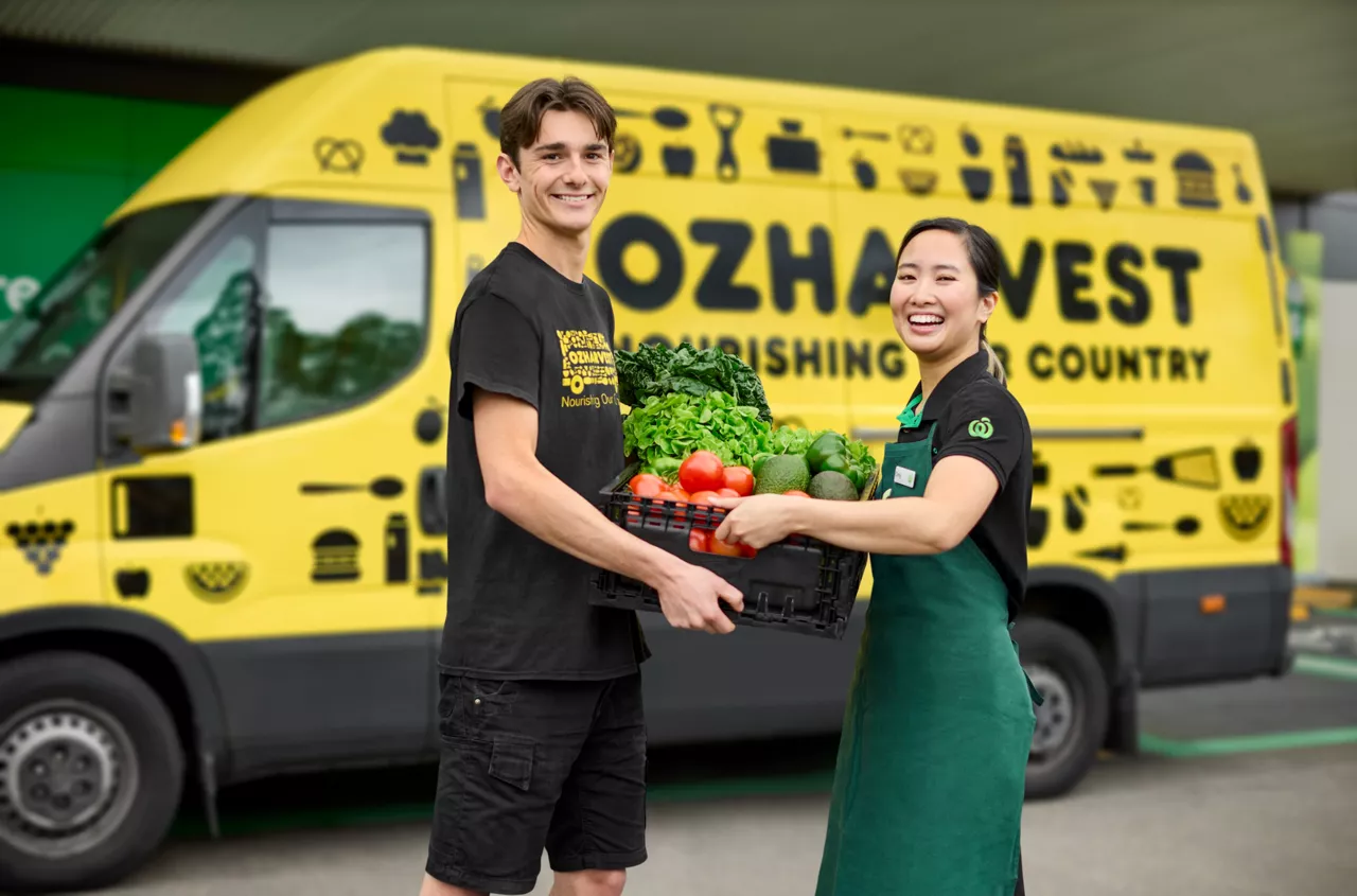Girls carrying baskets of supplies