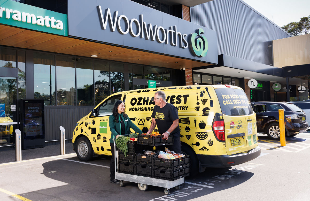 ozharvest van outside woolworths store with surplus food