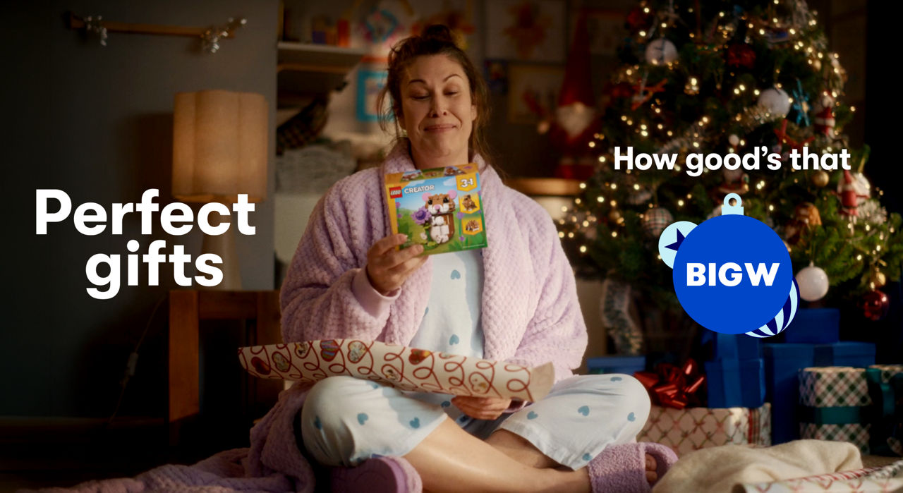 Woman holding a LEGO set, with text on screen reading 'Perfect gifts'.
