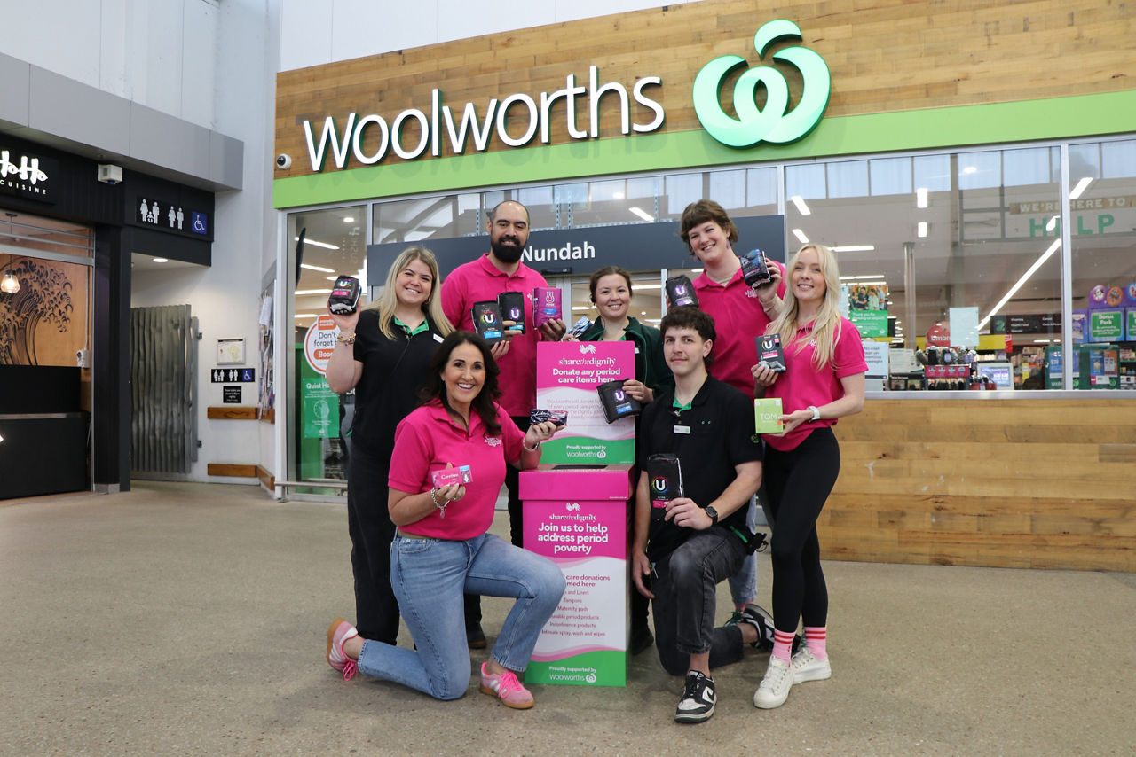 Woolworths team and Share the Dignity outside Woolworths store