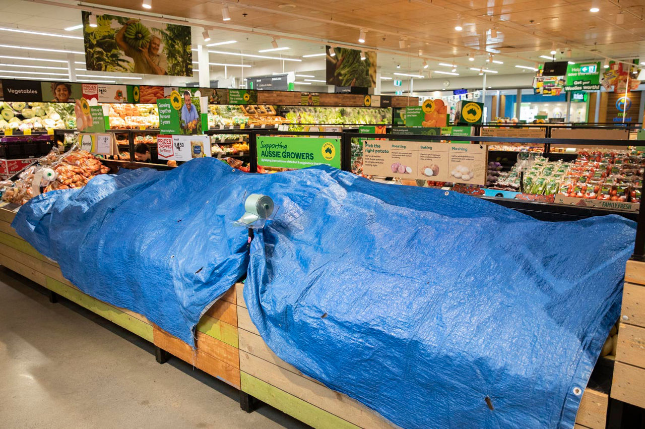 Woolworths potatoes covered by a tarpaulin overnight